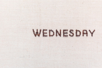 The word Wednesday written with coffee beans , aligned to the right.