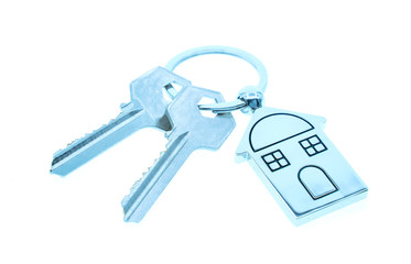 key chain with house symbol and keys on white background,Real estate concept