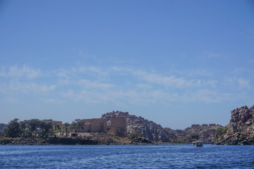 Fototapeta na wymiar Aswan, Egypt: Launches on Lake Nasser take tourists to Agilkia Island and the relocated temple complex of Philae, built during the Ptolemaic Kingdom.