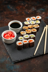Japanese sushi on a rustic dark background.
