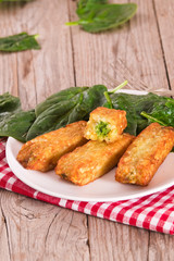 Potato croquettes with spinach and mozzarella.