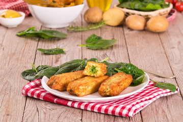 Potato croquettes with spinach and mozzarella.