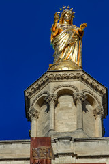 Fototapeta na wymiar Gilded statue of Virgin Mary at Notre-Dame des Doms cathedral in Avignon, France