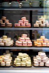Colorful Macaroons. tasty French macaroon in the shop window. Dessert at pastry confectionary shop. Summer sweets