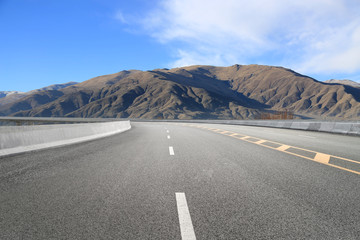 Empty highways and distant mountains