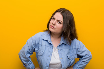 Young curvy plus size woman scolding someone very angry.