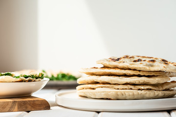 Qutab, azerbaijani flat bread with greens on a light background, a traditional dish.