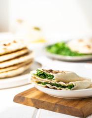 Qutab, azerbaijani flat bread with greens on a light background, a traditional dish.