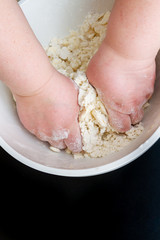 Mixing in a bowl of dough for the preparation of cottage cheese cookies