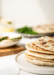 Qutab, azerbaijani flat bread with greens on a light background, a traditional dish.