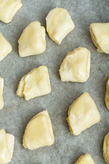 Cottage cheese cookies are on a baking sheet before cooking in the oven