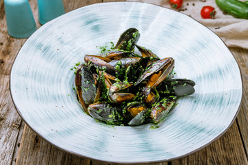 Mussels in wine sauce on plate