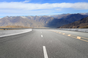 Empty highways and distant mountains