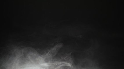 White exploding powder over black background