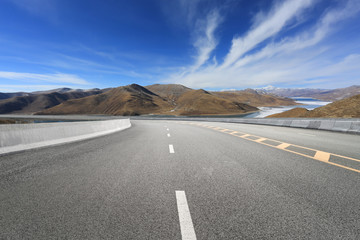Empty highways and distant mountains