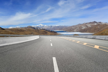 Empty highways and distant mountains