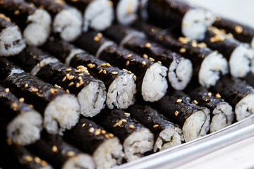 Rice roll with seaweed and sesame