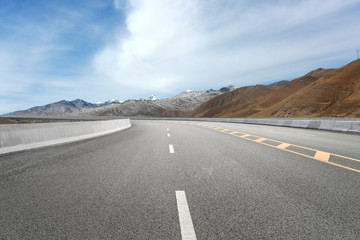 Empty highways and distant mountains