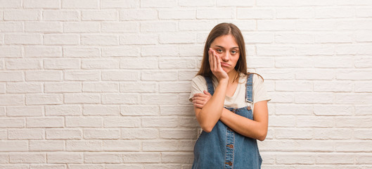 Young hipster woman tired and very sleepy