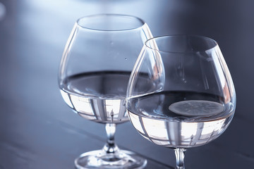 glass of water with ice in the restaurant / cold clear clear water in a glass with ice pieces