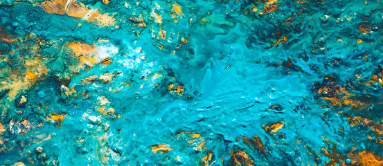 Abstract art texture background. Morning sky design. Beautiful acrylic turquoise blue and yellow paint splash.