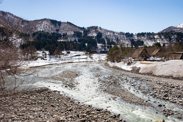 Japan - March 17th, 2018: River at The historic village of Shirakawa-go, a UNESCO World Heritage Site.