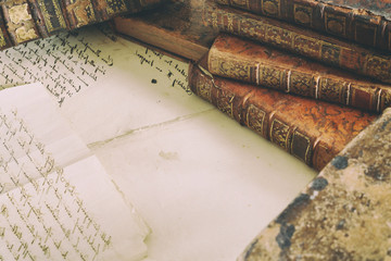 workspace with old books and handwriting