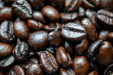 Close up of group black coffee beans. Strong black espresso, Grains of coffee background, texture