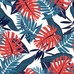 Seamless pattern with colorful red and blue tropical plants. Vector design.