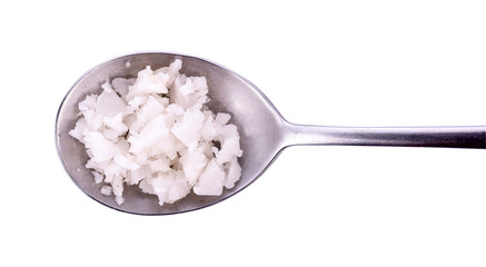 Sea salt in spoon on white background