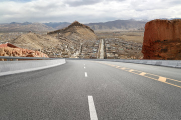 Empty highways and distant mountains