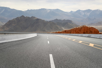 Empty highways and distant mountains