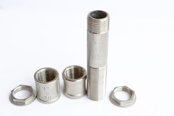 Stainless steel fittings, threaded fitting for water and gas pipes. Isolated object.