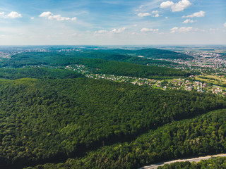 Fototapeta na wymiar aerial view of the city in the center of green forest