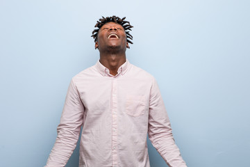 Obraz premium Young business african black man relaxed and happy laughing, neck stretched showing teeth.