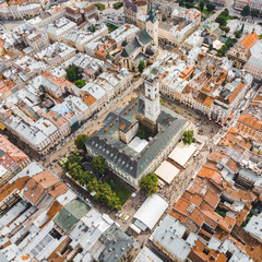 aerial view old european city with red roofs. city hall tower