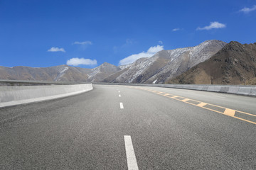 Empty highways and distant mountains