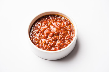 Schezwan Sauce / Szechuan chutney is an important ingredient in Chinese recipe. served in a bowl, isolated.  selective focus
