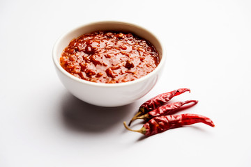 Schezwan Sauce / Szechuan chutney is an important ingredient in Chinese recipe. served in a bowl, isolated.  selective focus