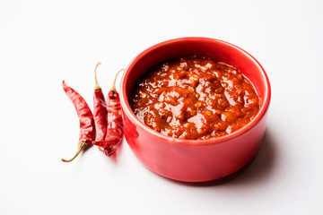 Schezwan Sauce / Szechuan chutney is an important ingredient in Chinese recipe. served in a bowl, isolated.  selective focus