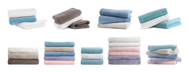 Set of folded soft terry towels on white background