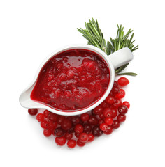 Pitcher of cranberry sauce with rosemary on white background, top view