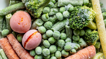frozen vegetables: broccoli, cherry tomatoes, french bean, pea, carrot, top view