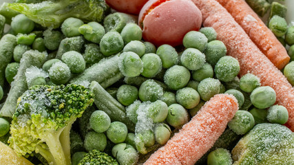 frozen vegetables: broccoli, cherry tomatoes, french bean, pea, carrot, top view - 267634242