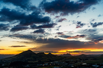 Sunset  over Mountains and City