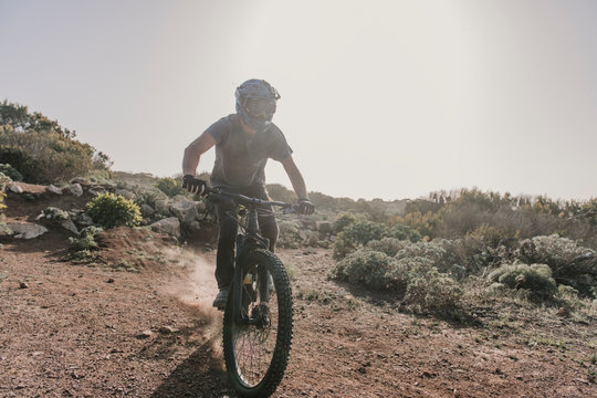 Spain, Lanzarote, mountain biker on a trip in desertic landscape