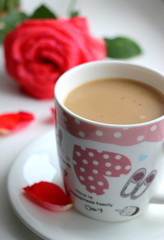  Beautiful and cute female cup of coffee and milk. Cappuccino and rose. Morning with coffee and flowers. Romance.
