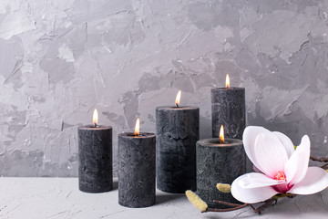 Spa setting with candles and flowers.