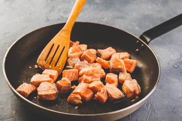 Salmon fillets in frying pan