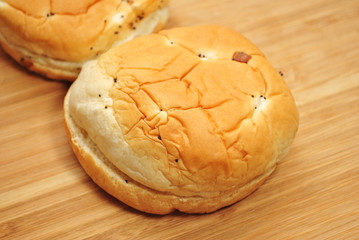 Close Up of an Onion Roll on a Wooden Surface
